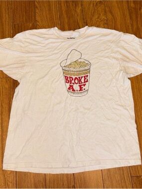 White graphic tee with funny meme graphic